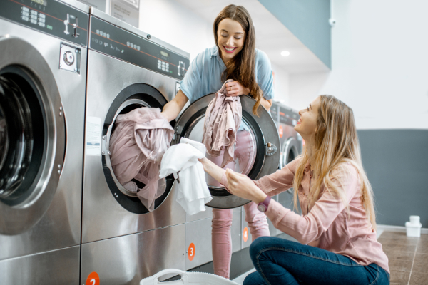Two Girl Friends Doing Laundry 600X400
